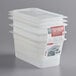 A stack of Cambro translucent plastic food pans with seal covers.