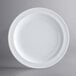 An Acopa Foundations white melamine plate with a narrow white rim.