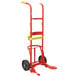 A red hand truck with yellow handle and wheels.