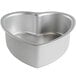 A Fat Daddio's silver anodized aluminum heart shaped cake pan.