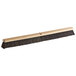 A Carlisle hardwood broom head with horsehair and tampico bristles.