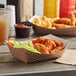 A Carnival King paper food tray with chicken wings and fries.