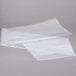 Two white plastic bags containing roll of Disposable Bun Pan Rack Covers.