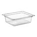 A clear Vigor polycarbonate food pan on a counter.