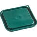 A green square Vigor food storage container lid with a hole in the middle.