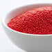A bowl of red nonpareils.