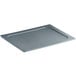 A grey rectangular Vigor food pan lid on a grey rectangular food pan.