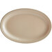 An Acopa tan melamine oval platter with a white surface and a white border.