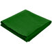 a green folded cloth on a white background