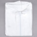 A folded white Cordova Premium Polypropylene Coverall.