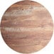 A Lancaster Table & Seating round wood table top with a textured Yukon oak finish and white lines.