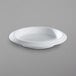 A white Corona by GET Enterprises porcelain salad bowl.