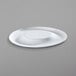 A bright white rectangular porcelain plate with a small rim on a gray surface.