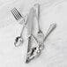 A close-up of a Fortessa Medici stainless steel butter knife.