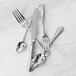 A close-up of a Fortessa Medici stainless steel cake fork.