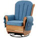 A blue L.A. Baby wood swivel glider rocker with a cushion.