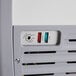 An Avantco glass top display ice cream freezer with a white background.