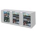 A Beverage-Air stainless steel back bar wine refrigerator with drinks in it.