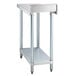 A Regency stainless steel filler table with a galvanized undershelf.