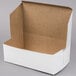 A white cardboard box with a brown edge.