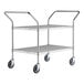 A silver metal Regency two-shelf utility cart with black wheels.