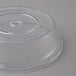 A Carlisle clear polycarbonate plate cover with a circular hole.