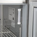 A Beverage-Air worktop refrigerator / freezer with a thermometer on it.