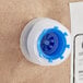 A plastic spool with blue caps on white background.