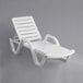 A white plastic chaise lounge chair.