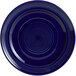 A cobalt blue Tuxton Concentrix china plate with a spiral pattern.