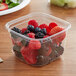 a plastic container of berries