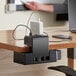 A Luxor KwikBoost EdgePower charging unit clamped to a table.