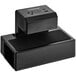 A black rectangular Luxor EdgePower charging unit on a counter.