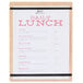 A white menu board with a Cal-Mil menu on it.