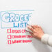 A hand using an Aarco blackboard/dry erase eraser on a whiteboard.