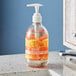 A bottle of Seventh Generation Mandarin Orange & Grapefruit liquid hand soap on a counter.