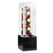 A Cal-Mil Midnight bamboo infusion beverage dispenser with fruits in it.