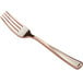 A close up of a Visions rose gold plastic fork.