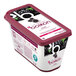 A container of blackberry yogurt with Les Vergers Boiron Blackberry Puree on top.
