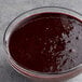A bowl of Les Vergers Boiron blueberry puree on a counter.