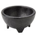 A black polypropylene Molcajete bowl with three legs.