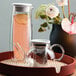A Villeroy & Boch Artesano glass teapot with strainer on a tray.