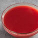 A bowl of Les Vergers Boiron blood orange puree on a counter.