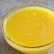 A bowl of Les Vergers Boiron pineapple fruit puree on a counter.