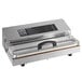 A silver rectangular Weston Vacuum Packaging Machine with a black handle.