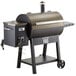 A black and silver Backyard Pro wood-fired pellet grill with a lid.