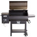 A Backyard Pro wood-fired pellet grill with the lid open.