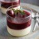 a cherry in a glass with a stem