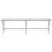 An Advance Tabco stainless steel work table with an open base and metal legs.