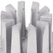 A silver metal Nemco push block with ten sections.